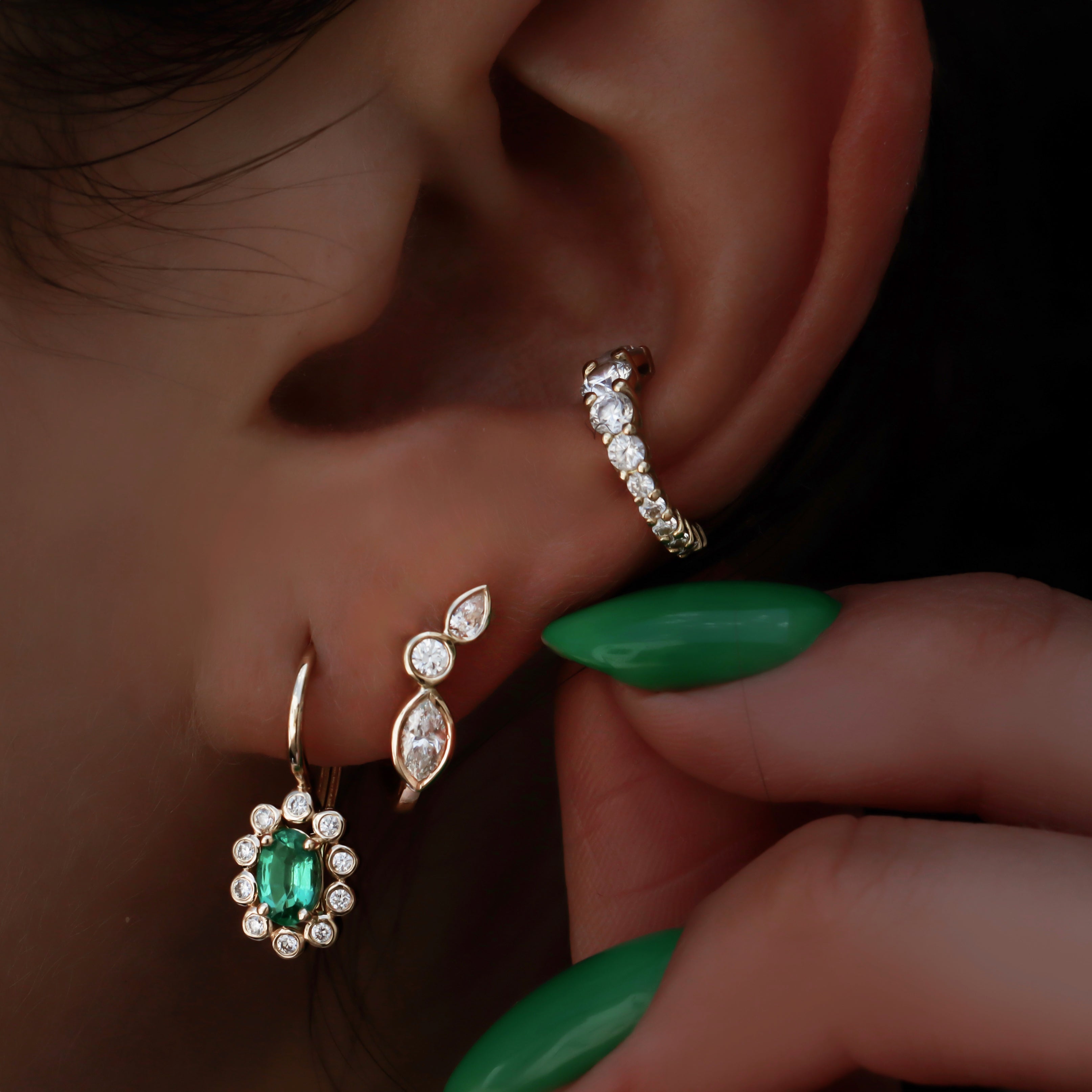 Yellow gold and diamond bezel wing hoop