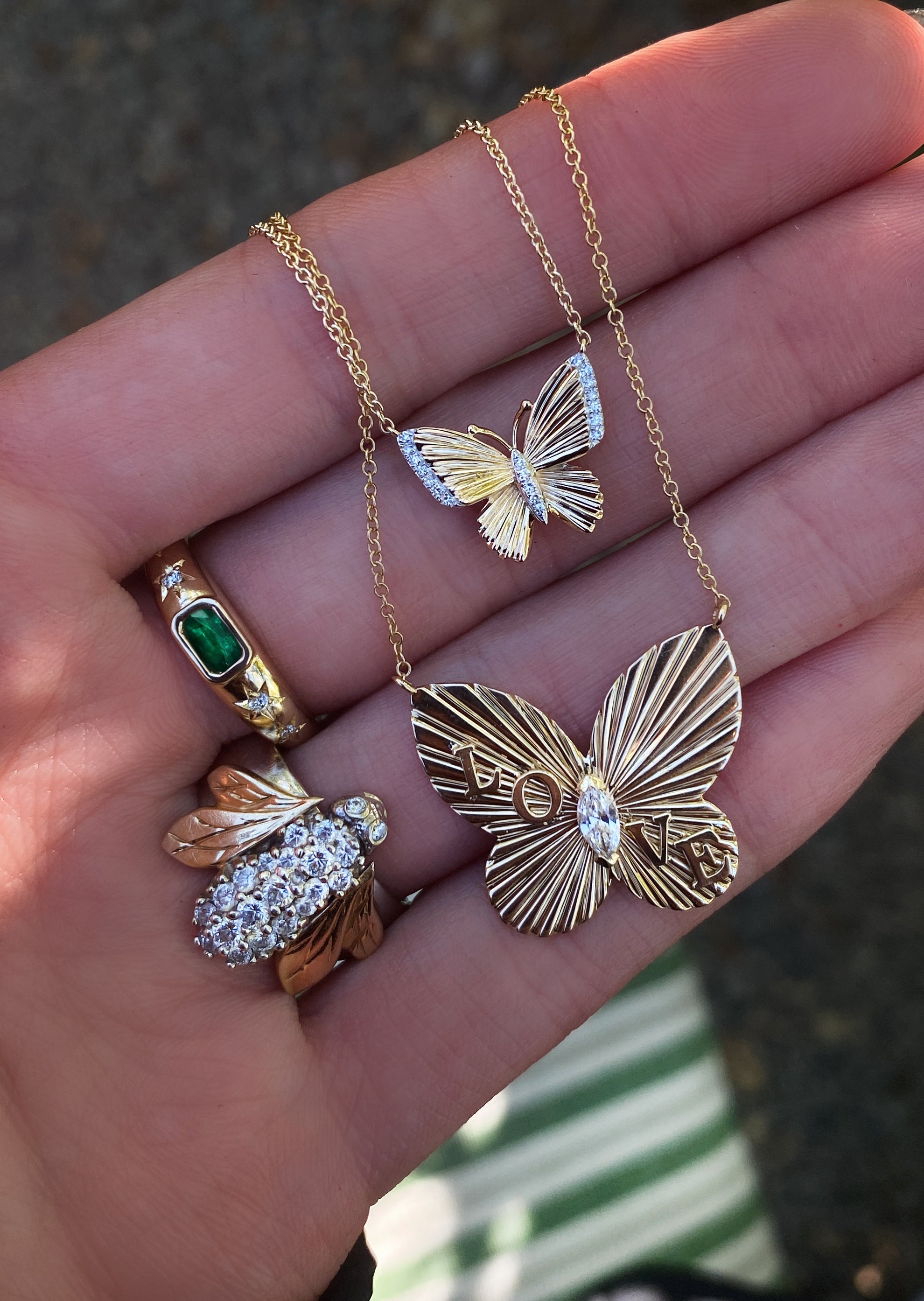 Yellow gold and diamond butterfly burst love necklace