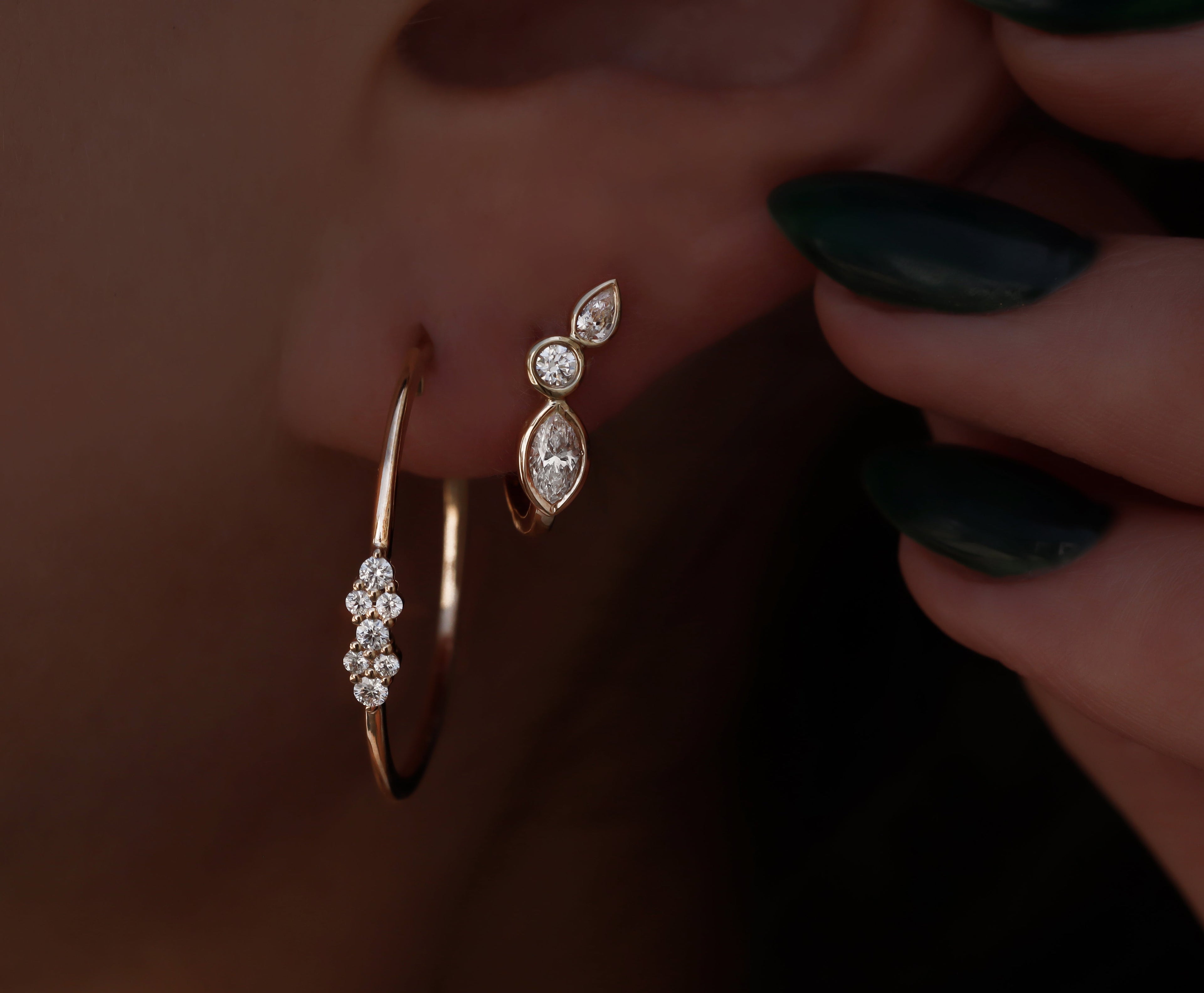 Yellow gold and diamond bezel wing hoop